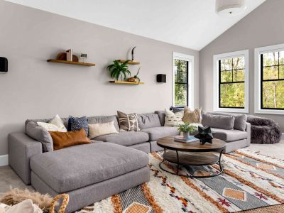 beautiful living room interior with colorful area rug large couch and abundant natural light 1210163723 a6f8f523c80a41b3a1272de88db0cc21